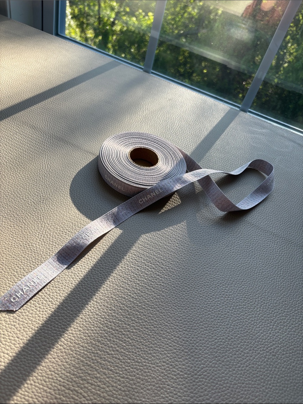 CHANEL woven logo ribbon in dusty lavender